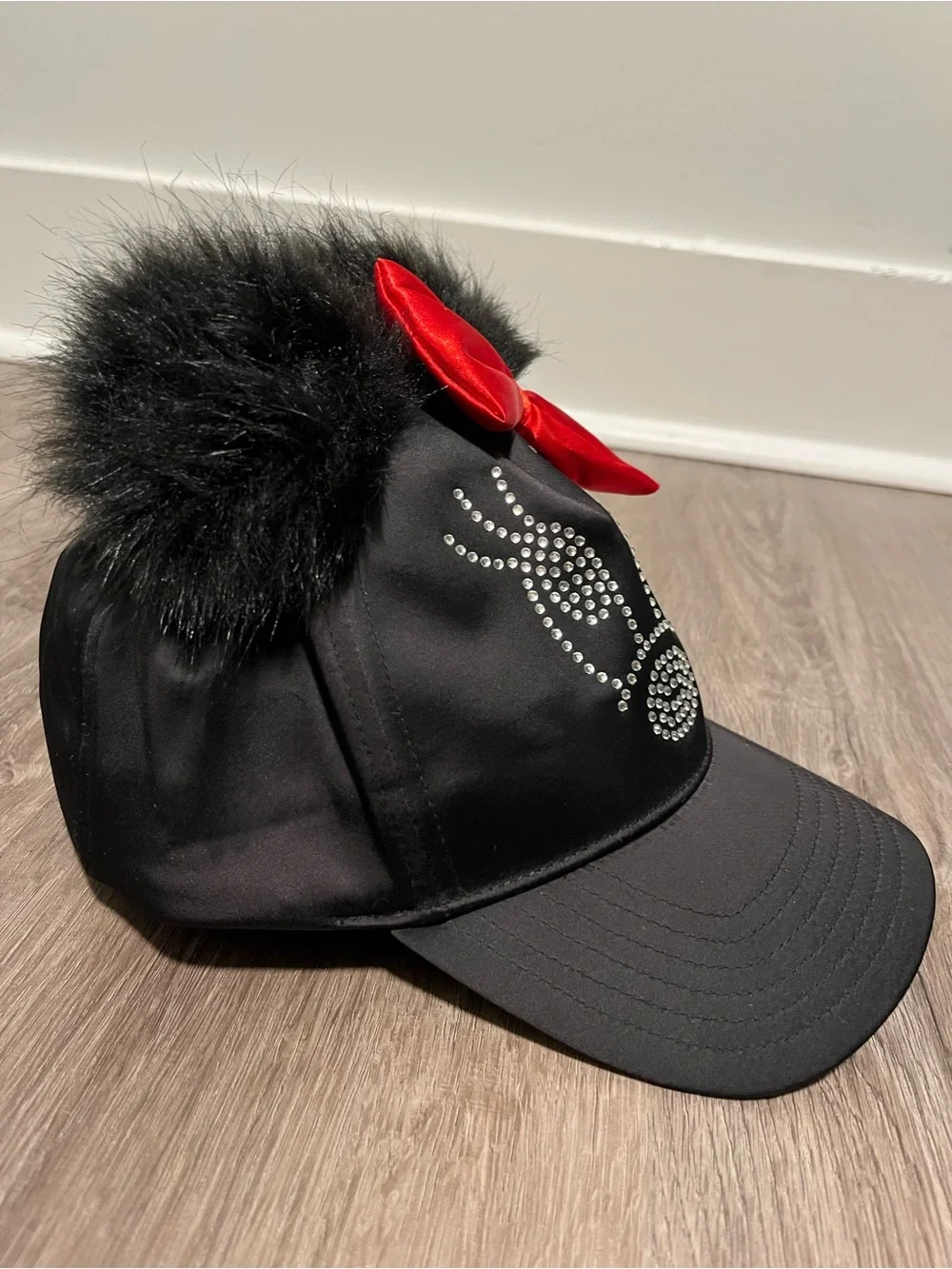 Disney Parks Black Faux Fur Ear Cap with Red Bow and Rhinestones NWOT